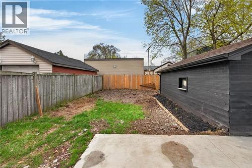 Concrete patio area extending to a yard space - 36 Mahony Avenue, Hamilton, ON - Outdoor