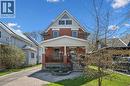 Brick exterior with a prominent front porch, white columns, and a pediment-style roofline - 115 Allen Street E, Waterloo, ON  - Outdoor With Deck Patio Veranda 