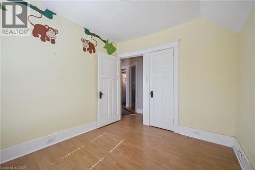 Light-toned wood-finish flooring with a subtle herringbone pattern - 115 Allen Street E, Waterloo, ON - Indoor Photo Showing Other Room