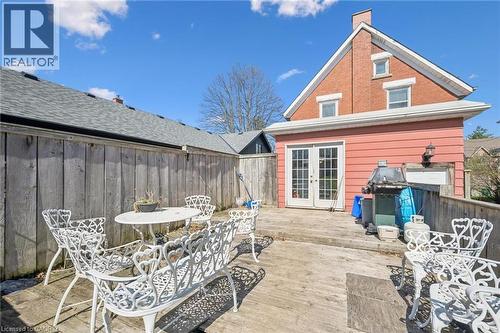 Expansive outdoor deck area featuring a wood fence perimeter and double French doors providing direct access to the interior - 115 Allen Street E, Waterloo, ON - Outdoor