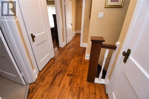 Hallway featuring wood-finish flooring, light tan walls, and white trim - 522 Aberdeen Avenue, Hamilton, ON - Indoor Photo Showing Other Room
