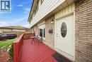 Brick and siding exterior featuring a red-painted wood deck - 116 Gainsborough Road, Hamilton, ON  - Outdoor With Exterior 
