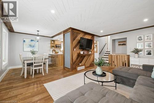 Open-concept living space with wood-finish flooring - 522 Glendene Crescent, Waterloo, ON - Indoor Photo Showing Other Room
