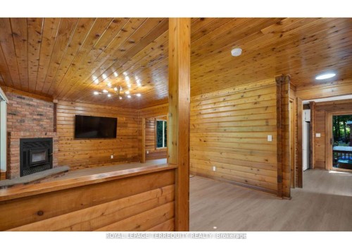 2668 Mcdonald Road, Springwater, ON - Indoor Photo Showing Other Room With Fireplace