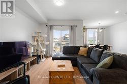 living room with sliding doors to private balcony - 
