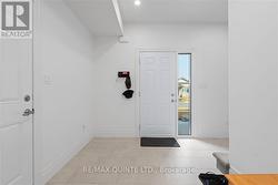 main floor entryway with door to garage - 