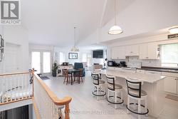Open kitchen, dining and living space. - 