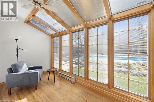 Sunroom featuring wood-finish flooring, a vaulted ceiling with exposed wood beams, and a ceiling fan - 277 Blackacres Boulevard, London, ON - Indoor Photo Showing Other Room