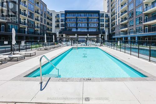 431 - 16 Concord Place, Grimsby, ON - Outdoor With In Ground Pool With Balcony