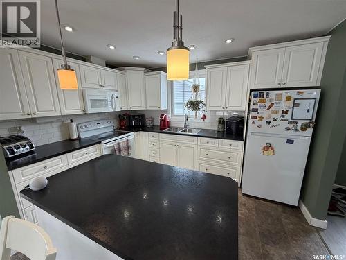 739 Hudson Crescent, Hudson Bay, SK - Indoor Photo Showing Kitchen With Double Sink