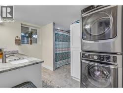 Lower level main bath with laundry. - 