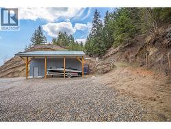 End of the shop with lean-to for storing toys. - 