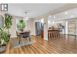 Dining room and kitchen. Huge granite island and countertops. Stainless steel appliances. - 