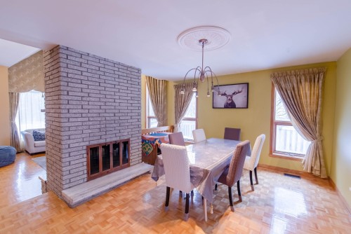 Dining Room - 9105 Crois. Rimouski, Brossard, QC - Indoor Photo Showing Dining Room With Fireplace
