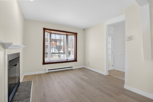 Living Room - 10950  - 10952 Av. Lausanne, Montréal (Montréal-Nord), QC - Indoor Photo Showing Other Room With Fireplace