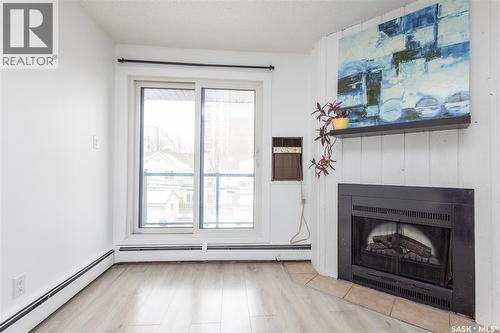307 512 4Th Avenue N, Saskatoon, SK - Indoor Photo Showing Living Room With Fireplace