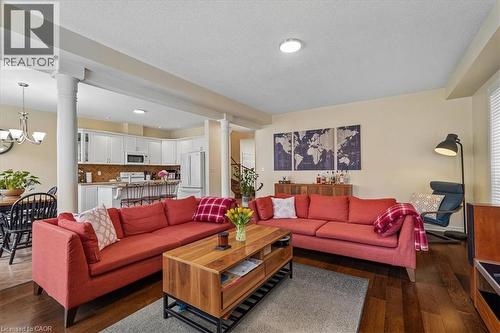 Open-concept living area featuring rich wood-finish flooring - 4679 Webb Street, Burlington, ON - Indoor Photo Showing Living Room