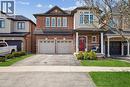 Two-story brick and stucco exterior with an attached two-car garage - 4679 Webb Street, Burlington, ON  - Outdoor With Facade 