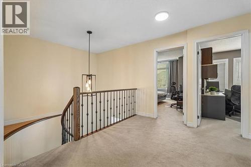 Upper-level landing featuring neutral carpet flooring and cream-colored walls - 4679 Webb Street, Burlington, ON - Indoor Photo Showing Other Room