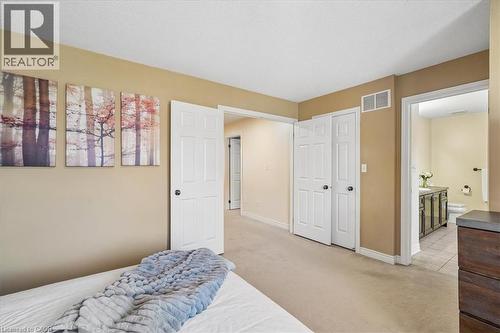 Carpeted room with neutral wall tones and white trim - 4679 Webb Street, Burlington, ON - Indoor Photo Showing Bedroom