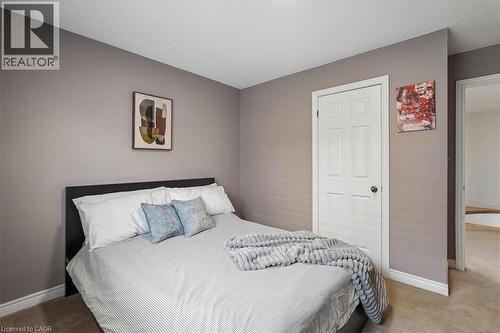 Bedroom featuring neutral-toned walls, white trim, and light-colored carpet - 4679 Webb Street, Burlington, ON - Indoor Photo Showing Bedroom