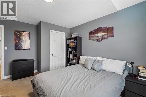 Carpeted room featuring gray painted walls and white trim - 4679 Webb Street, Burlington, ON - Indoor Photo Showing Bedroom