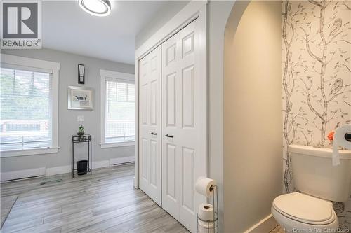 Laundry hidden behind closet doors on main floor - 8 Dane Row, Willow Grove, NB - Indoor Photo Showing Bathroom