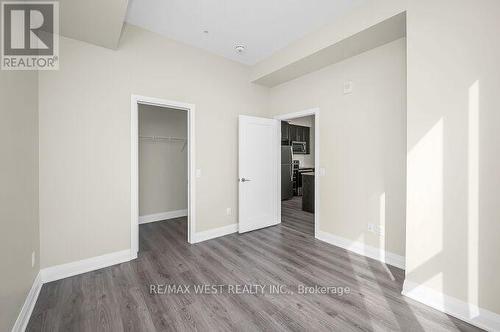 Primary Bedroom With Walk-in Closet - 615 - 16 Concord Place, Grimsby, ON - Indoor Photo Showing Other Room