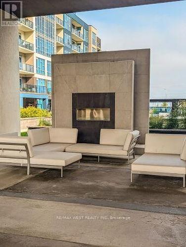 Outdoor Lounging - 615 - 16 Concord Place, Grimsby, ON -  Photo Showing Living Room With Fireplace