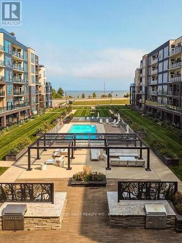 Lounging Poolside - 615 - 16 Concord Place, Grimsby, ON - Outdoor With In Ground Pool With Balcony