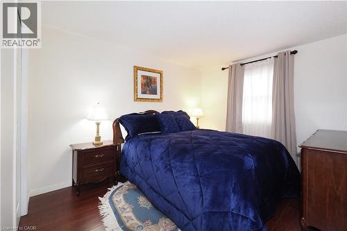 Bedroom featuring wood finished floors and baseboards - 89 Lynnhaven Court, Kitchener, ON - Indoor Photo Showing Bedroom