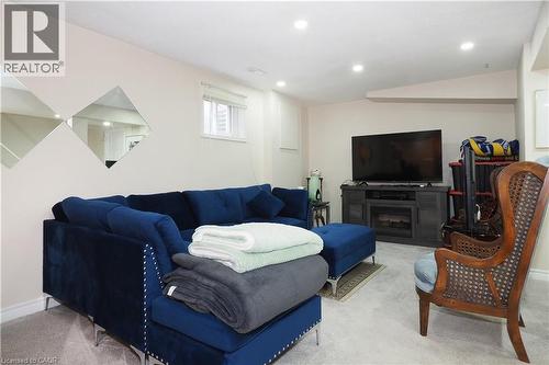 Carpeted living room featuring recessed lighting and vaulted ceiling - 89 Lynnhaven Court, Kitchener, ON - Indoor