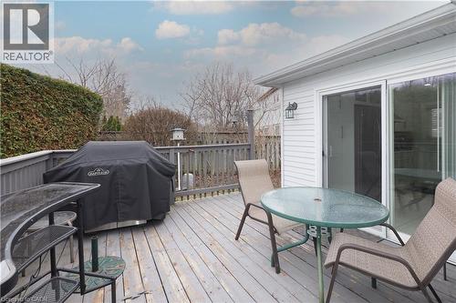Wooden terrace featuring a grill and outdoor dining space - 89 Lynnhaven Court, Kitchener, ON - Outdoor With Deck Patio Veranda With Exterior