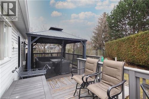 Wooden deck featuring outdoor furniture, a gazebo, and a fenced backyard - 89 Lynnhaven Court, Kitchener, ON - Outdoor With Deck Patio Veranda