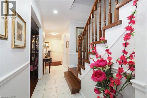 Corridor featuring crown molding and light tile patterned flooring - 89 Lynnhaven Court, Kitchener, ON - Indoor Photo Showing Other Room