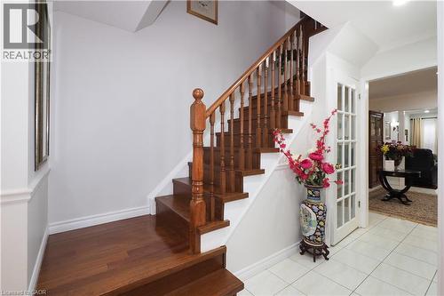 Staircase with baseboards - 89 Lynnhaven Court, Kitchener, ON - Indoor Photo Showing Other Room