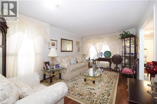 Living room with wood finished floors and crown molding - 89 Lynnhaven Court, Kitchener, ON - Indoor Photo Showing Living Room