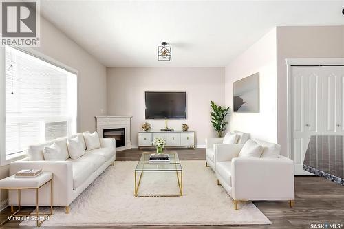 401 3826 Dewdney Avenue E, Regina, SK - Indoor Photo Showing Living Room With Fireplace