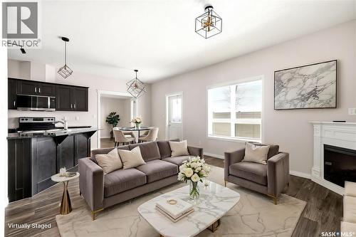 401 3826 Dewdney Avenue E, Regina, SK - Indoor Photo Showing Living Room With Fireplace