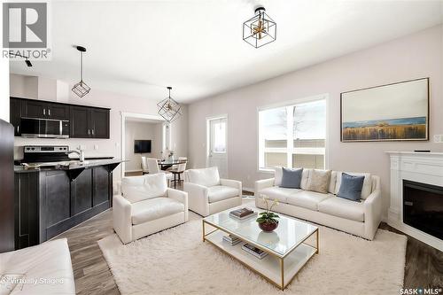 401 3826 Dewdney Avenue E, Regina, SK - Indoor Photo Showing Living Room With Fireplace