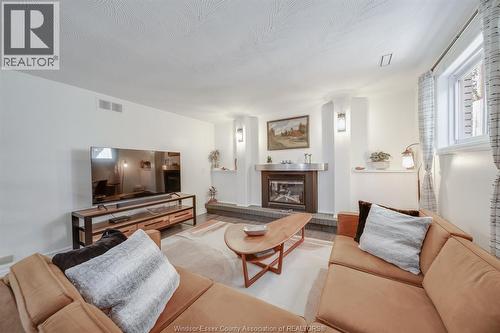 109 Centennial, Tecumseh, ON - Indoor Photo Showing Living Room With Fireplace