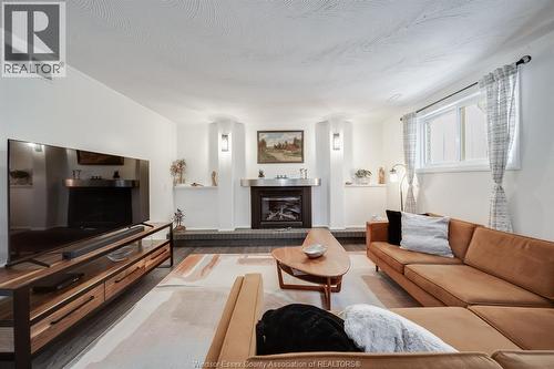 109 Centennial, Tecumseh, ON - Indoor Photo Showing Living Room With Fireplace