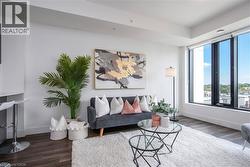 Spacious living area featuring large picture windows, - 