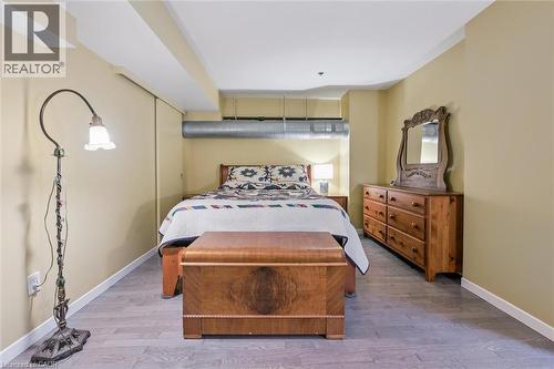 Bedroom featuring light wood-style floors and a closet - 85 Spruce Street Unit# 106, Cambridge, ON - Indoor Photo Showing Bedroom
