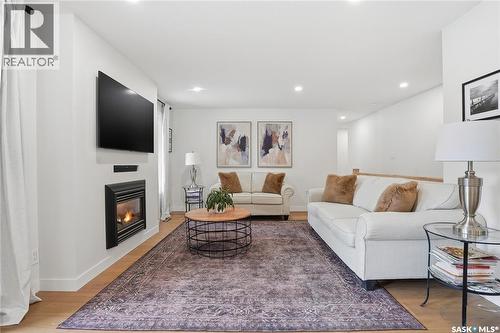 115 Whiteswan Drive, Saskatoon, SK - Indoor Photo Showing Living Room With Fireplace