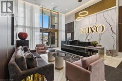 Grand lobby entrance featuring a large-format marble accent wall with illuminated signage - 