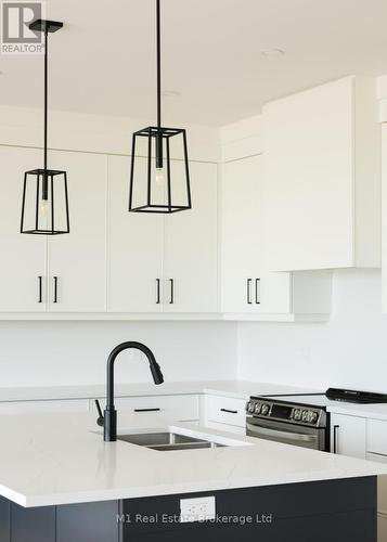 74 Bedell Drive, Mapleton, ON - Indoor Photo Showing Kitchen With Double Sink