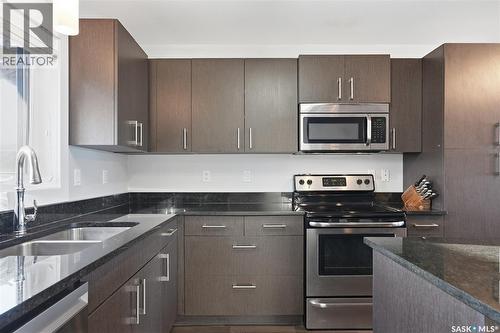 139 Maningas Bend, Saskatoon, SK - Indoor Photo Showing Kitchen With Stainless Steel Kitchen With Double Sink