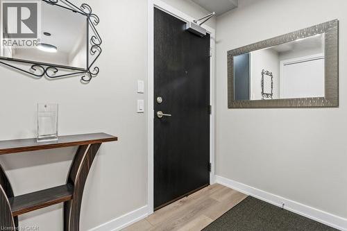 Entryway with light wood-type flooring and baseboards - 385 Winston Road Unit# 1402, Grimsby, ON - Indoor Photo Showing Other Room