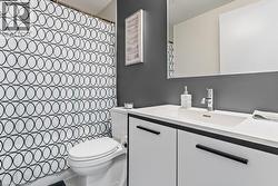 Full bathroom with vanity and a shower with shower curtain - 